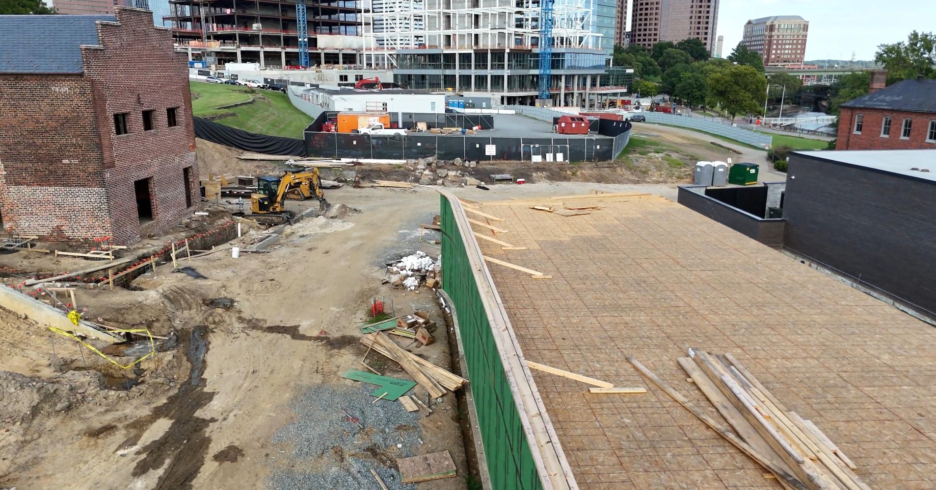 This photo shows off our logistical prowess - the L-shaped restroom building is being built in two phases, the Women's restroom (ladies first!) then the Men's restroom later, to allow for deliveries before the men's restroom closes off the Eastern portion of the job site to anything wider than 12 feet. 