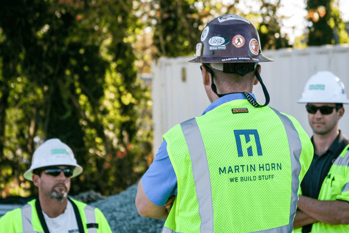 Employees Talking at Job Site